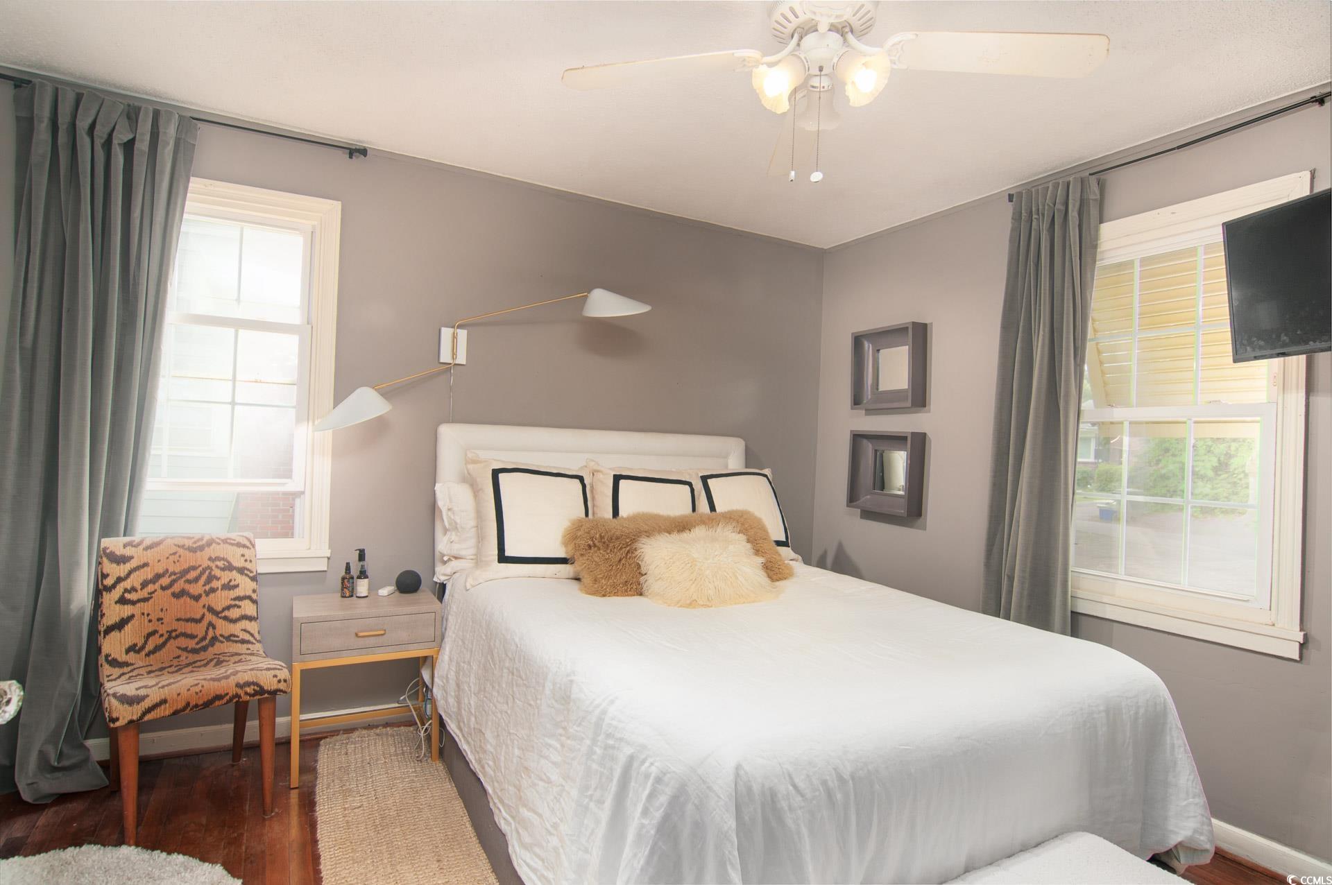 640 Willow Bank Road Georgetown, SC 29440 - Photo 16 of 18 Bedroom featuring wood finished floors, a ceiling fan, and baseboards