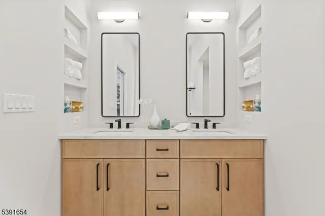 a spacious bathroom with a shower and a sink