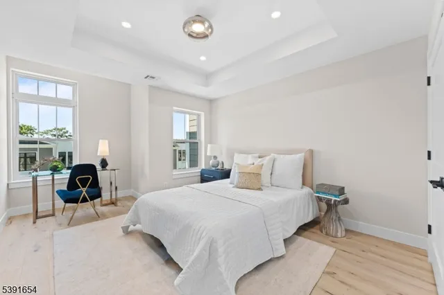 a bedroom with a bed and a chair