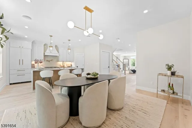 a large kitchen with a table and chairs