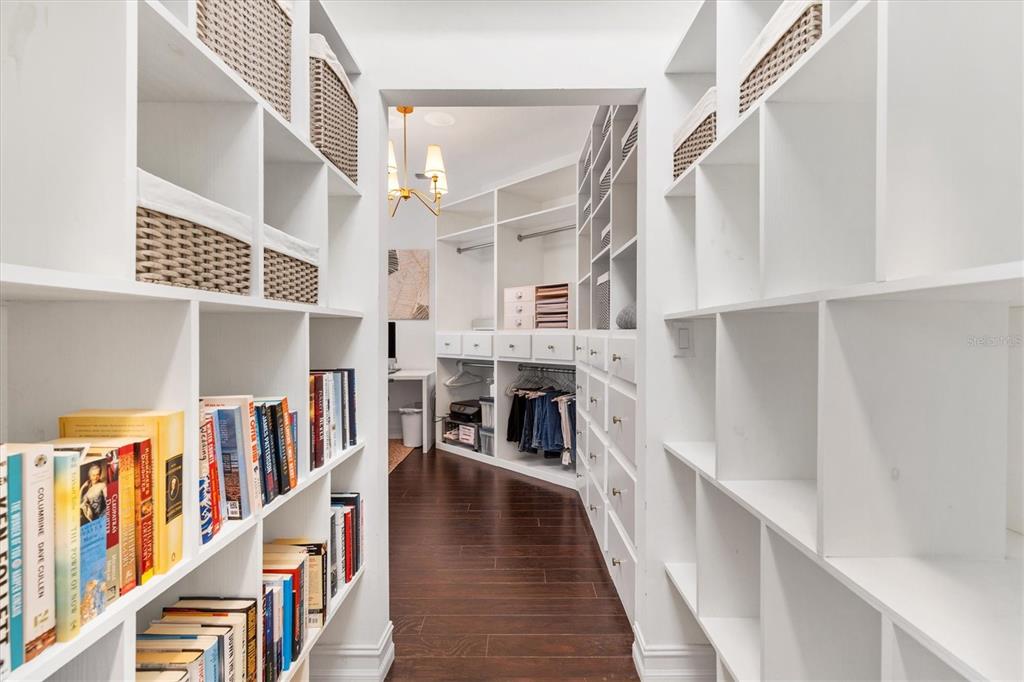 12114 Eagle Point Court Leesburg, FL 34788 - Photo 14 of 39 a view of staircase with lots of frames on wall and a window