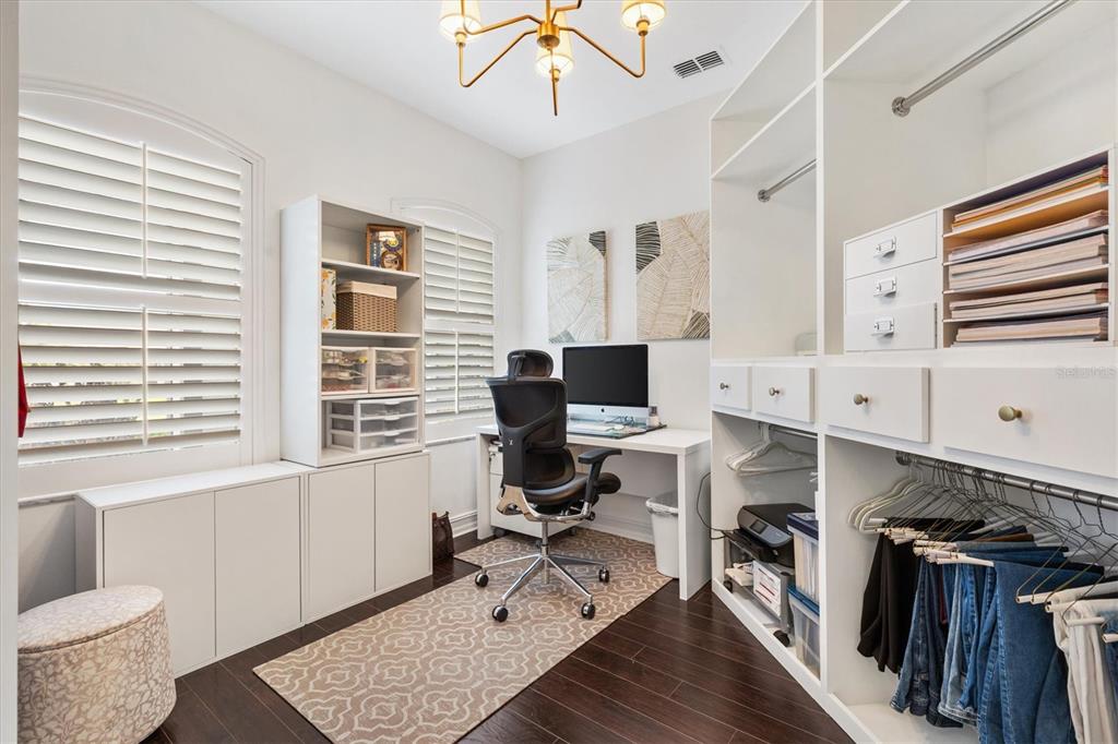 12114 Eagle Point Court Leesburg, FL 34788 - Photo 15 of 39 a view of a workspace with furniture and a window
