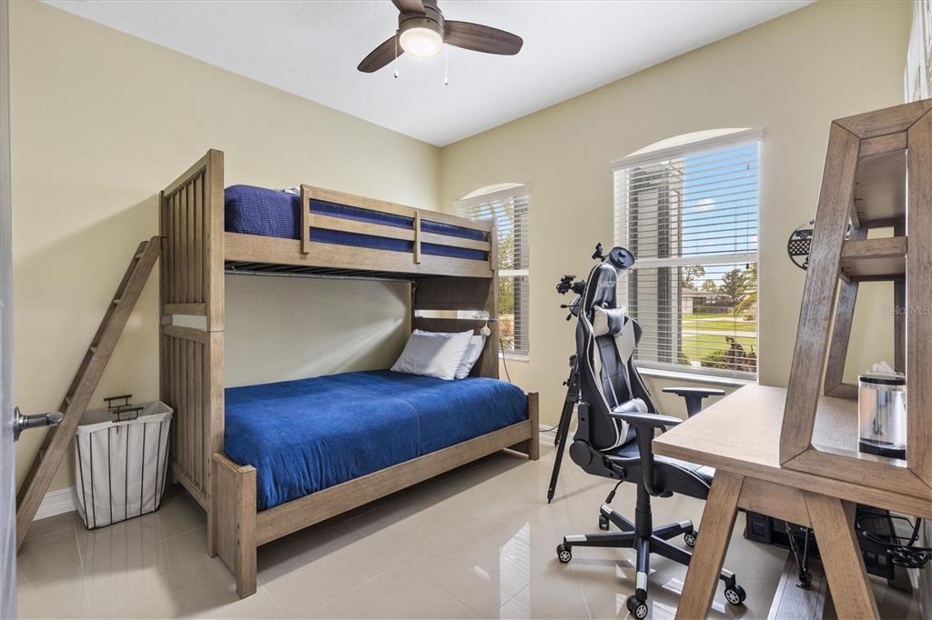 12114 Eagle Point Court Leesburg, FL 34788 - Photo 17 of 39 a bedroom with furniture and a window