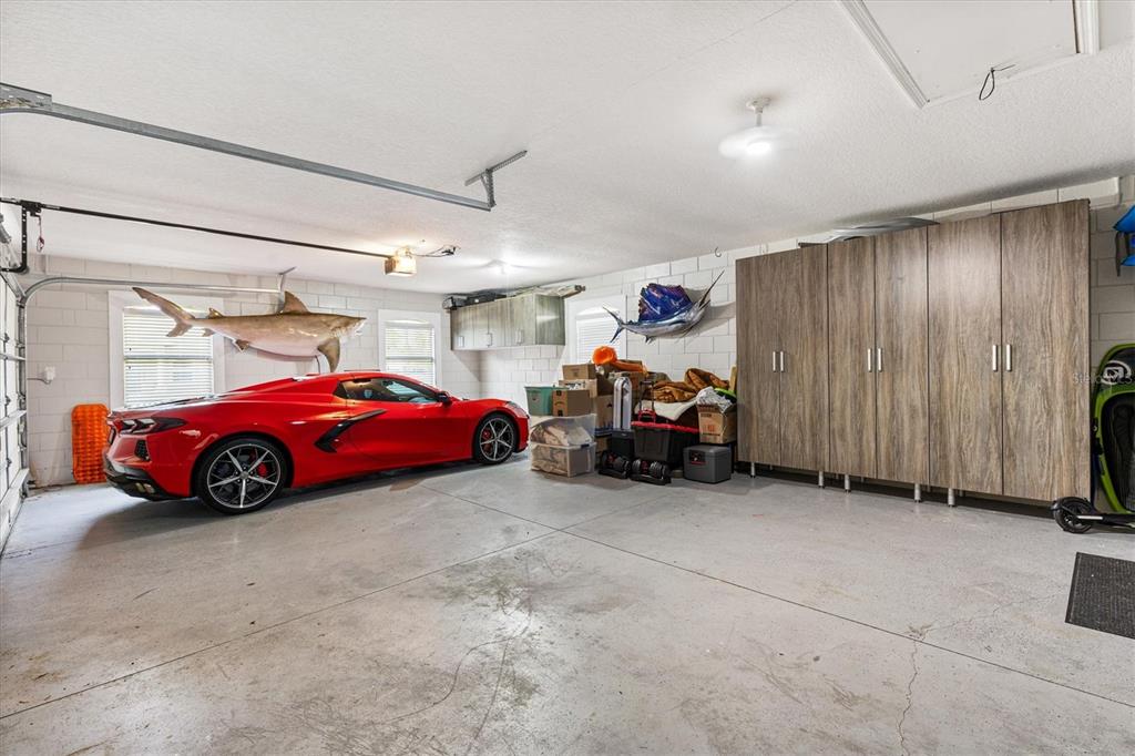 12114 Eagle Point Court Leesburg, FL 34788 - Photo 23 of 39 a view of a garage with parked cars