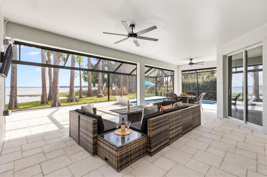 12114 Eagle Point Court Leesburg, FL 34788 - Photo 24 of 39 a living room with furniture and a large window