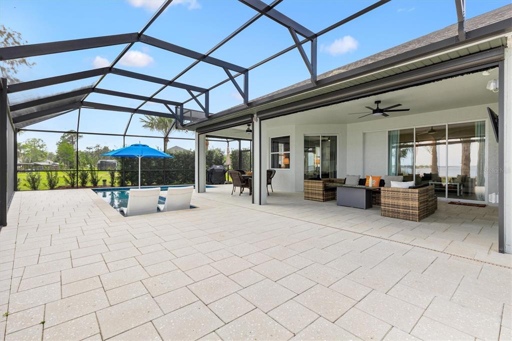 12114 Eagle Point Court Leesburg, FL 34788 - Photo 27 of 39 a view of a patio with table and chairs