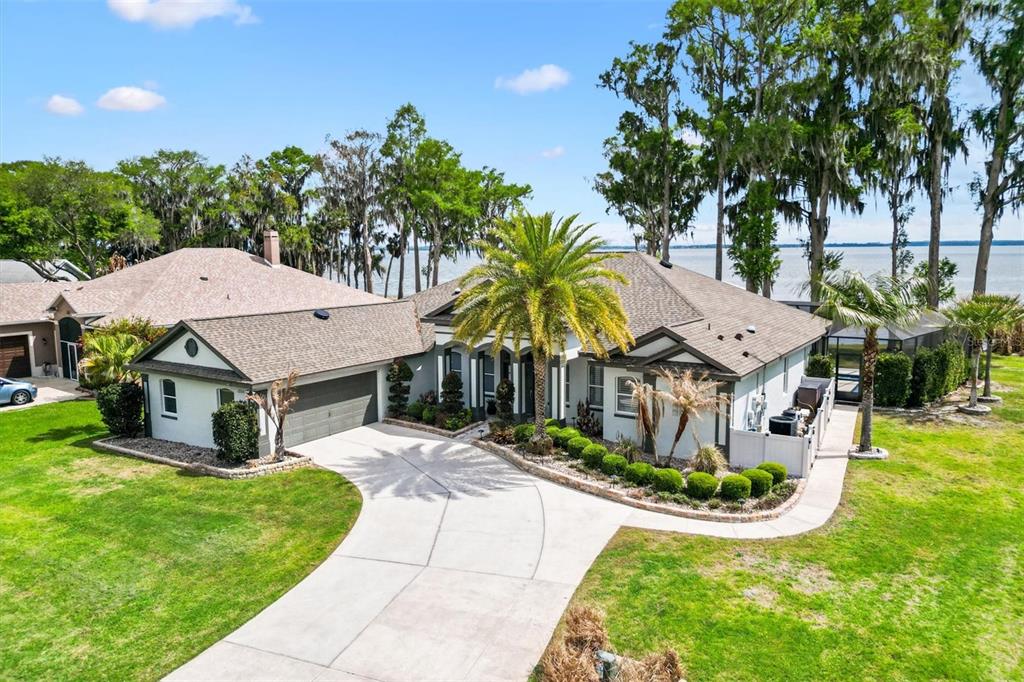12114 Eagle Point Court Leesburg, FL 34788 - Photo 36 of 39 a front view of a house with garden