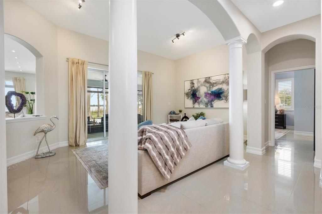 12114 Eagle Point Court Leesburg, FL 34788 - Photo 7 of 39 a living room with furniture and a table