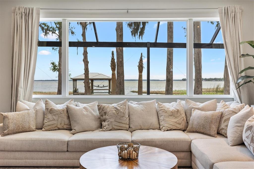 12114 Eagle Point Court Leesburg, FL 34788 - Photo 9 of 39 a living room with furniture and a large window
