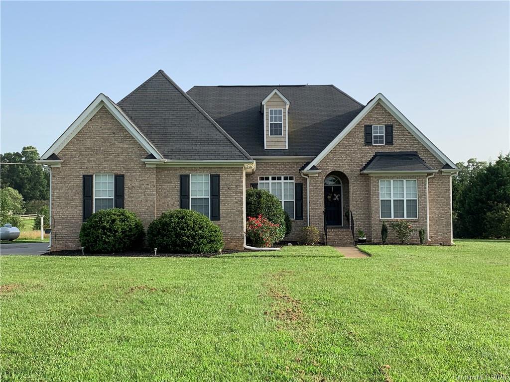 3812 Zebulon Williams Road Monroe, NC 28110 - Photo 1 of 31 a front view of a house with a yard and garage