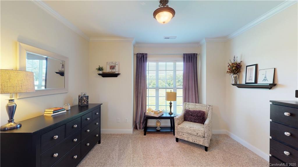 3812 Zebulon Williams Road Monroe, NC 28110 - Photo 11 of 31 a bedroom with a bed and a window