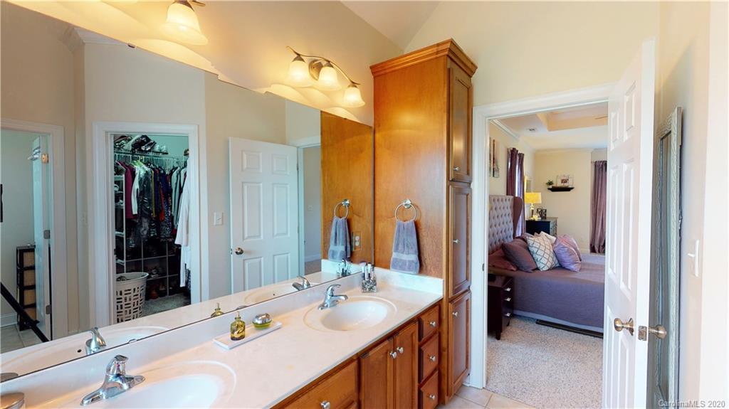 3812 Zebulon Williams Road Monroe, NC 28110 - Photo 13 of 31 a en suite bathroom with a sink double vanity and mirror