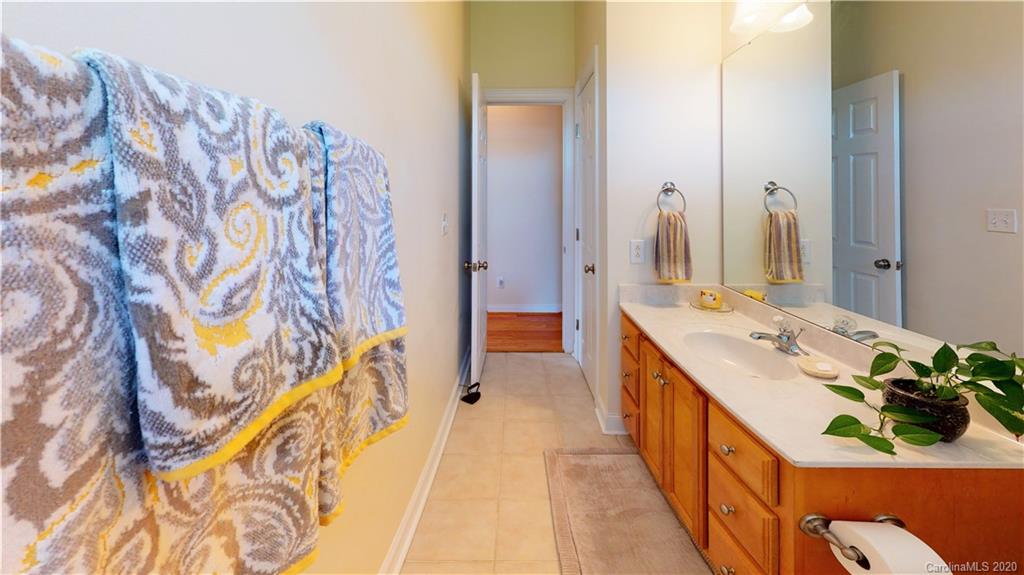 3812 Zebulon Williams Road Monroe, NC 28110 - Photo 18 of 31 a en suite bathroom with a sink and mirror