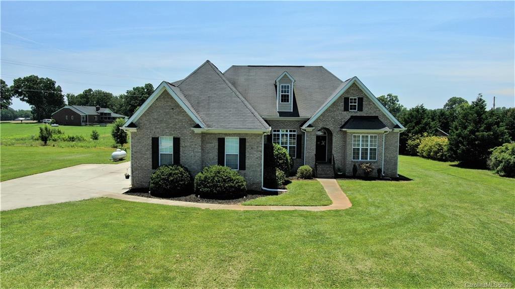 3812 Zebulon Williams Road Monroe, NC 28110 - Photo 23 of 31 a front view of a house with a yard