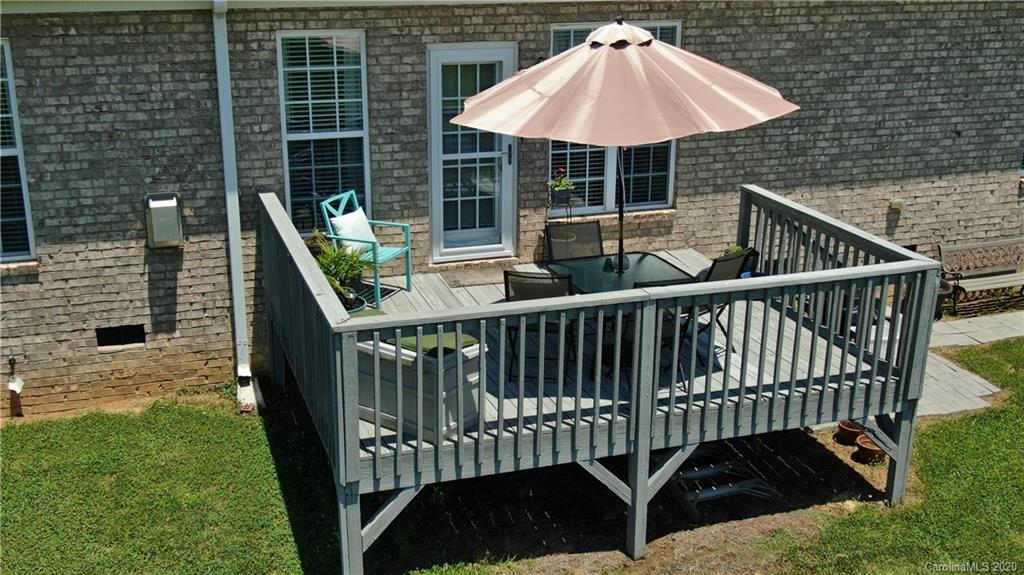 3812 Zebulon Williams Road Monroe, NC 28110 - Photo 26 of 31 a balcony of a house with table and chairs
