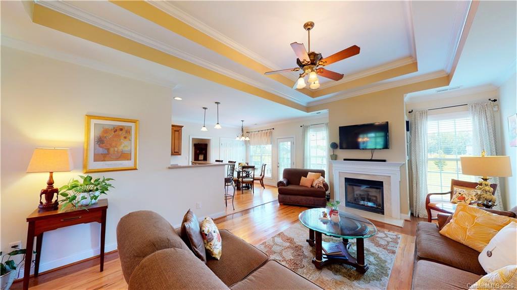 3812 Zebulon Williams Road Monroe, NC 28110 - Photo 5 of 31 a living room with furniture fireplace and a flat screen tv