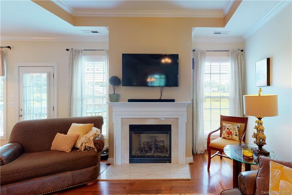 3812 Zebulon Williams Road Monroe, NC 28110 - Photo 6 of 31 a living room with furniture and a fireplace