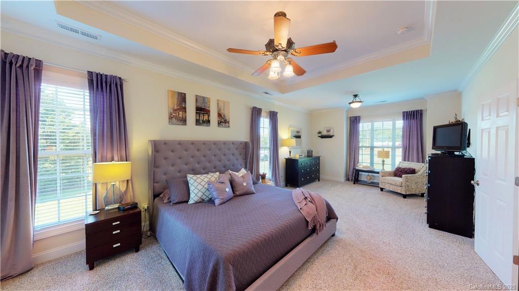 3812 Zebulon Williams Road Monroe, NC 28110 - Photo 10 of 31 a bedroom with a bed and furniture