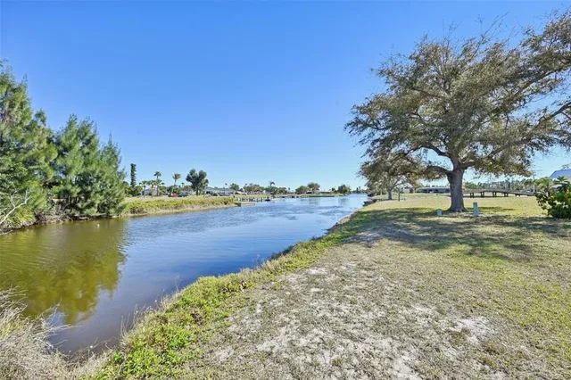 a view of a yard with a lake view