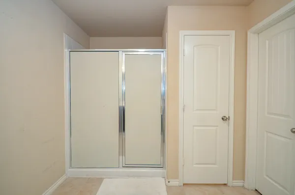 a front view of a house with a garden and yard