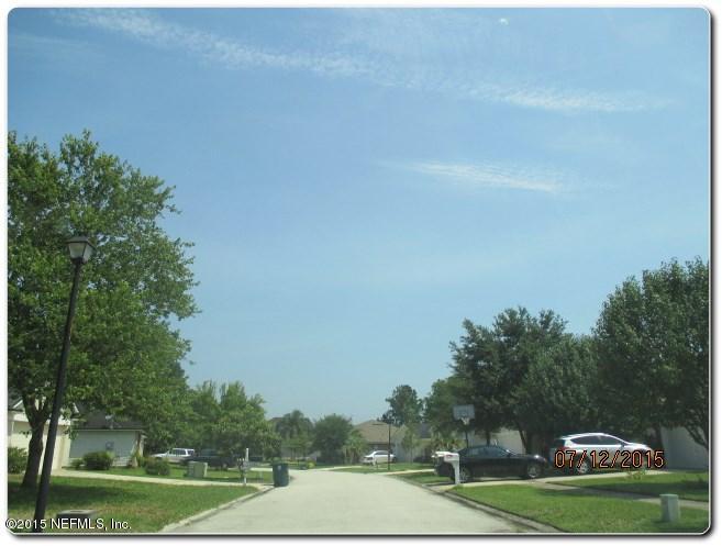 12066 Spring Ridge Drive Jacksonville, FL 32258 - Photo 2 of 18 a view of a green field