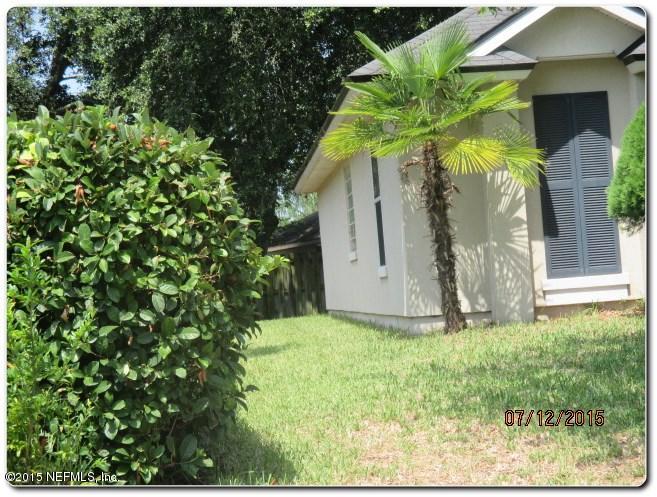 12066 Spring Ridge Drive Jacksonville, FL 32258 - Photo 3 of 18 a view of a house with a tree