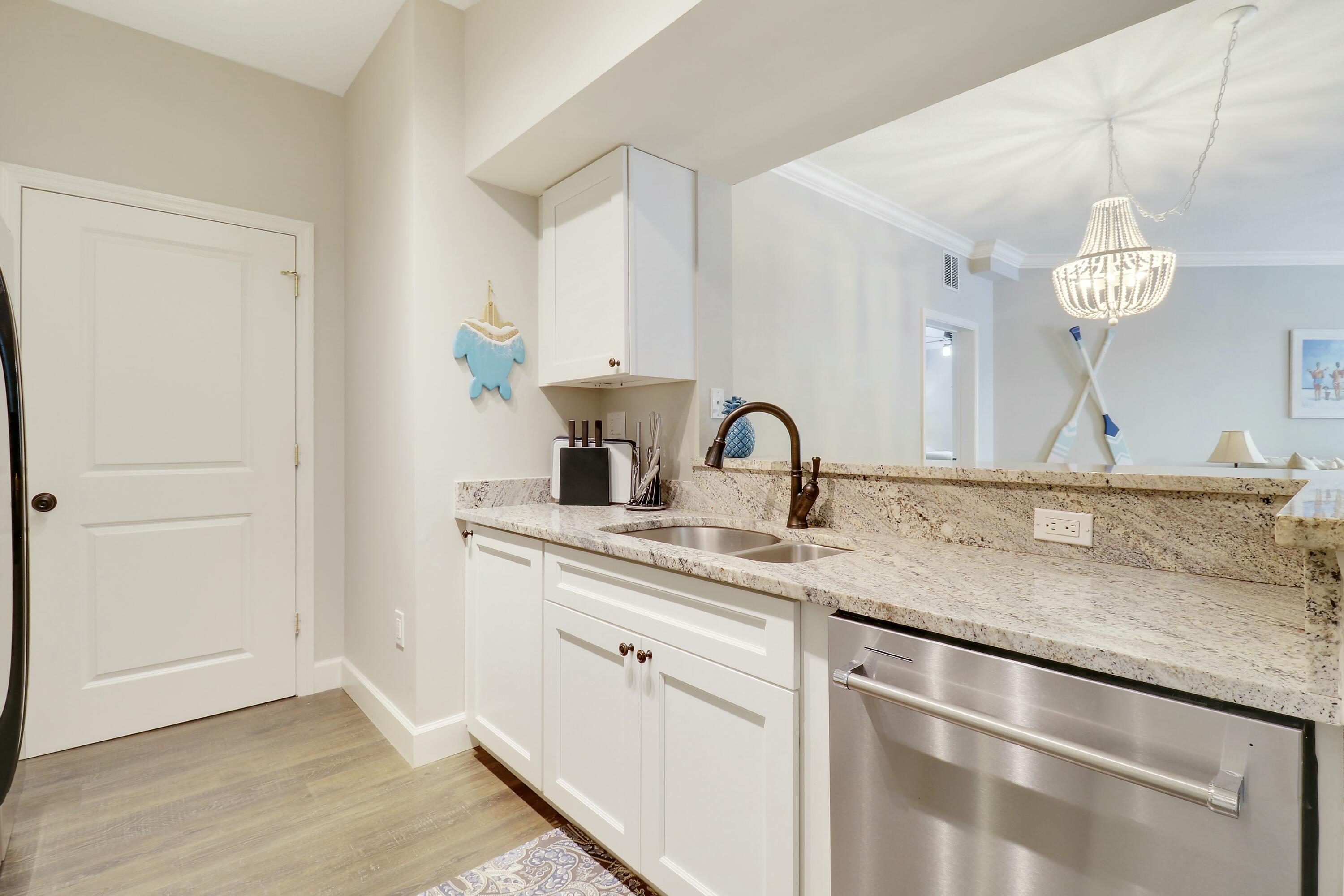 215 Northwest Flagler Avenue, Unit 301 Stuart, FL 34994 - Photo 12 of 34 a close view of sink and tap