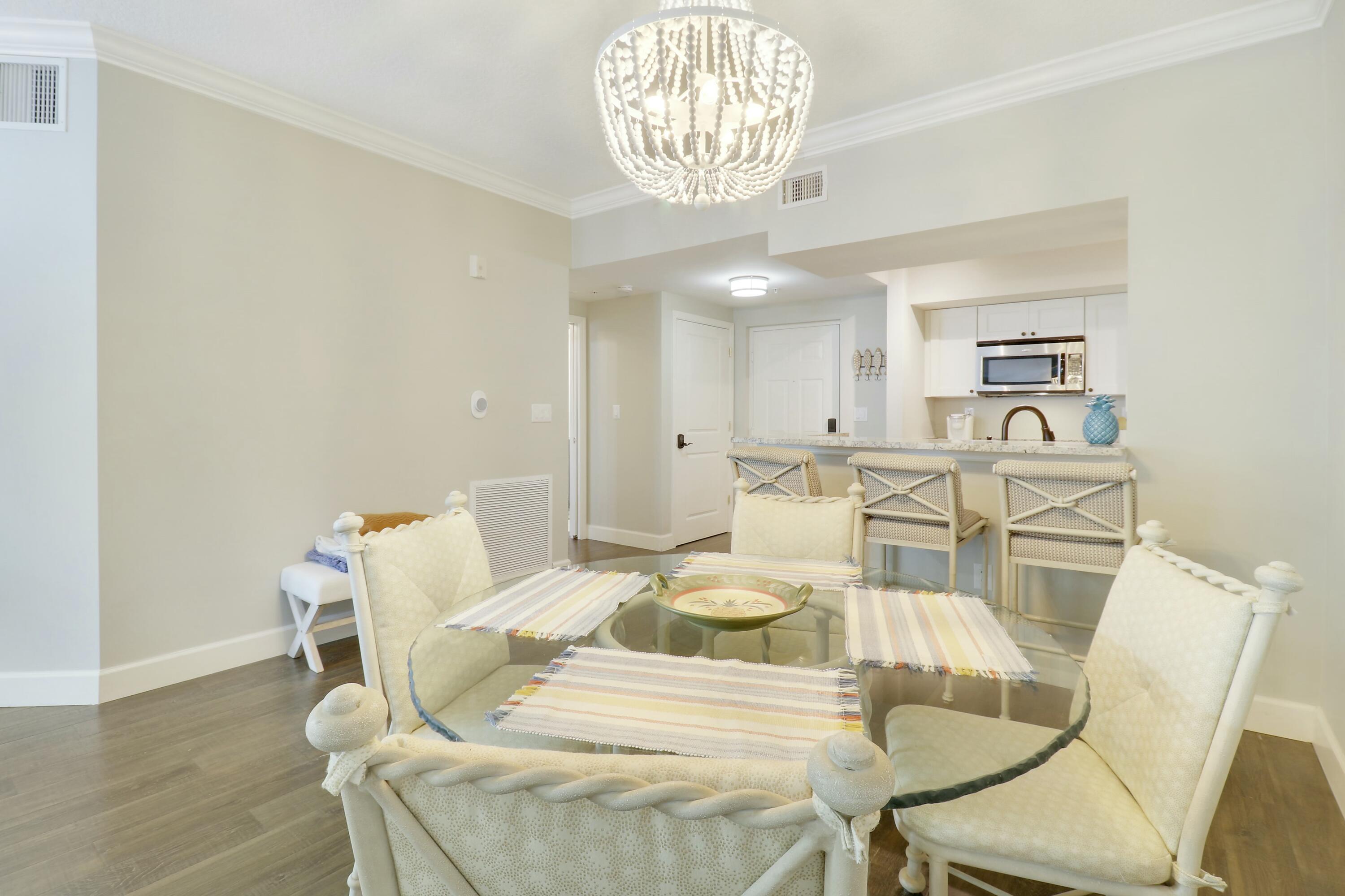 215 Northwest Flagler Avenue, Unit 301 Stuart, FL 34994 - Photo 15 of 34 a view of a dining room with furniture and wooden floor