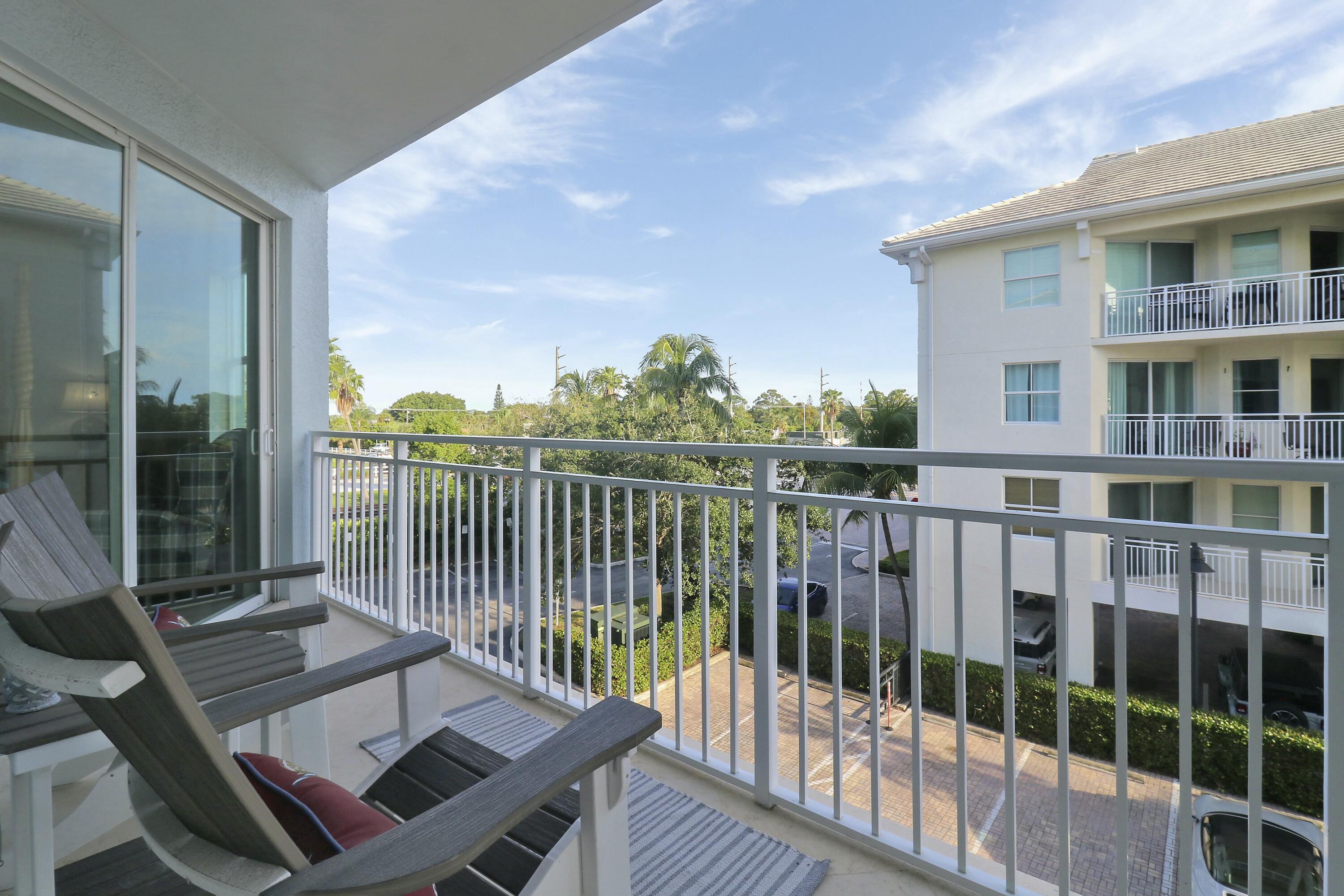 215 Northwest Flagler Avenue, Unit 301 Stuart, FL 34994 - Photo 25 of 34 a view of a balcony with couch