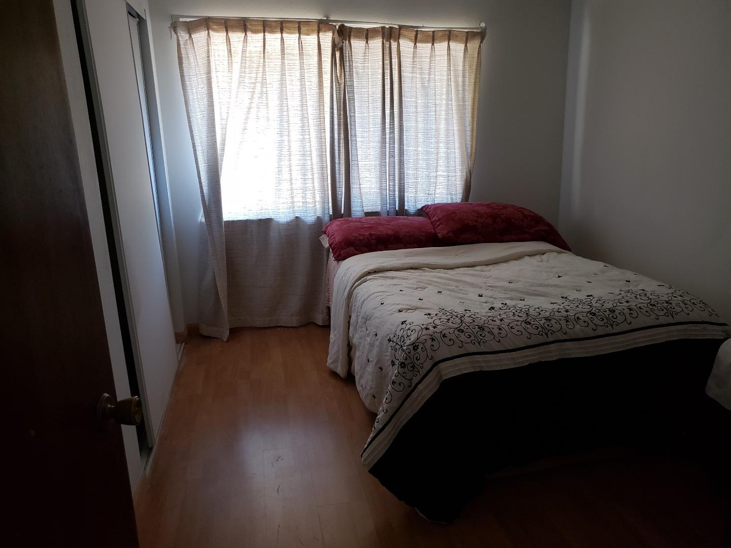 723 River Falls Drive San Jose, CA 95111 - Photo 17 of 20 a bedroom with a bed and wooden floor