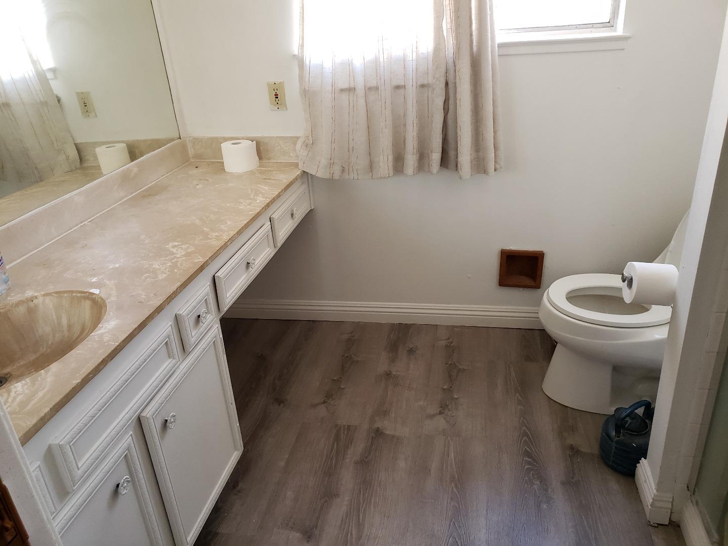 723 River Falls Drive San Jose, CA 95111 - Photo 18 of 20 a bathroom with a sink and a toilet