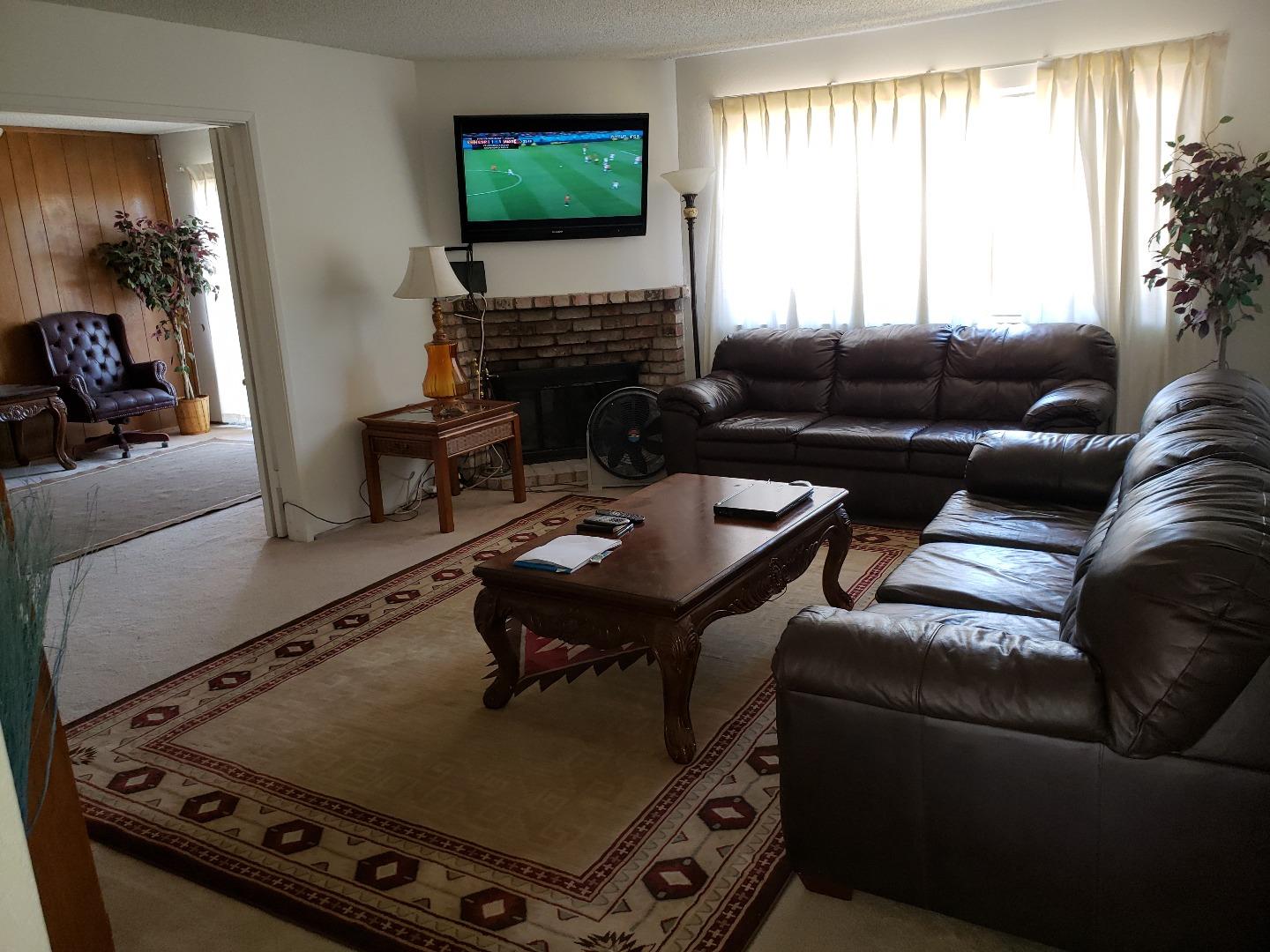 723 River Falls Drive San Jose, CA 95111 - Photo 8 of 20 a living room with furniture and a flat screen tv