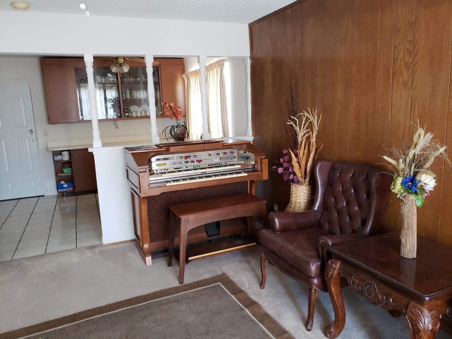 723 River Falls Drive San Jose, CA 95111 - Photo 10 of 20 a living room with furniture and a piano