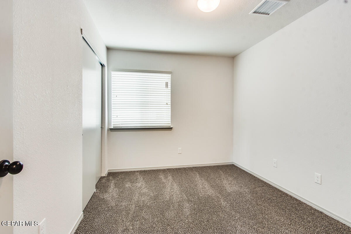 12420 Oconee Place Clint, TX 79836 - Photo 20 of 27 an empty room with a window
