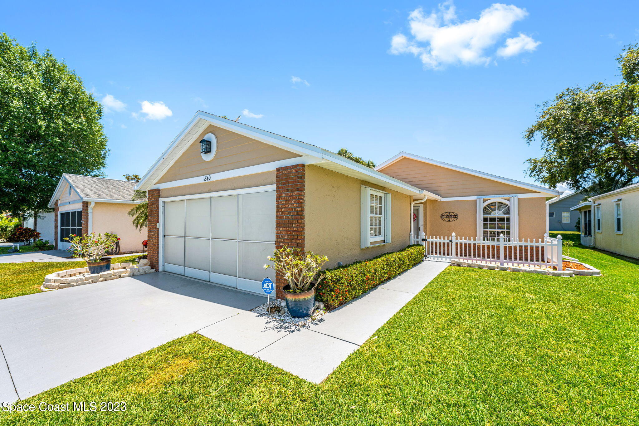 840 Cross Lake Drive Melbourne, FL 32901 - Photo 1 of 63 a front view of a house with garden