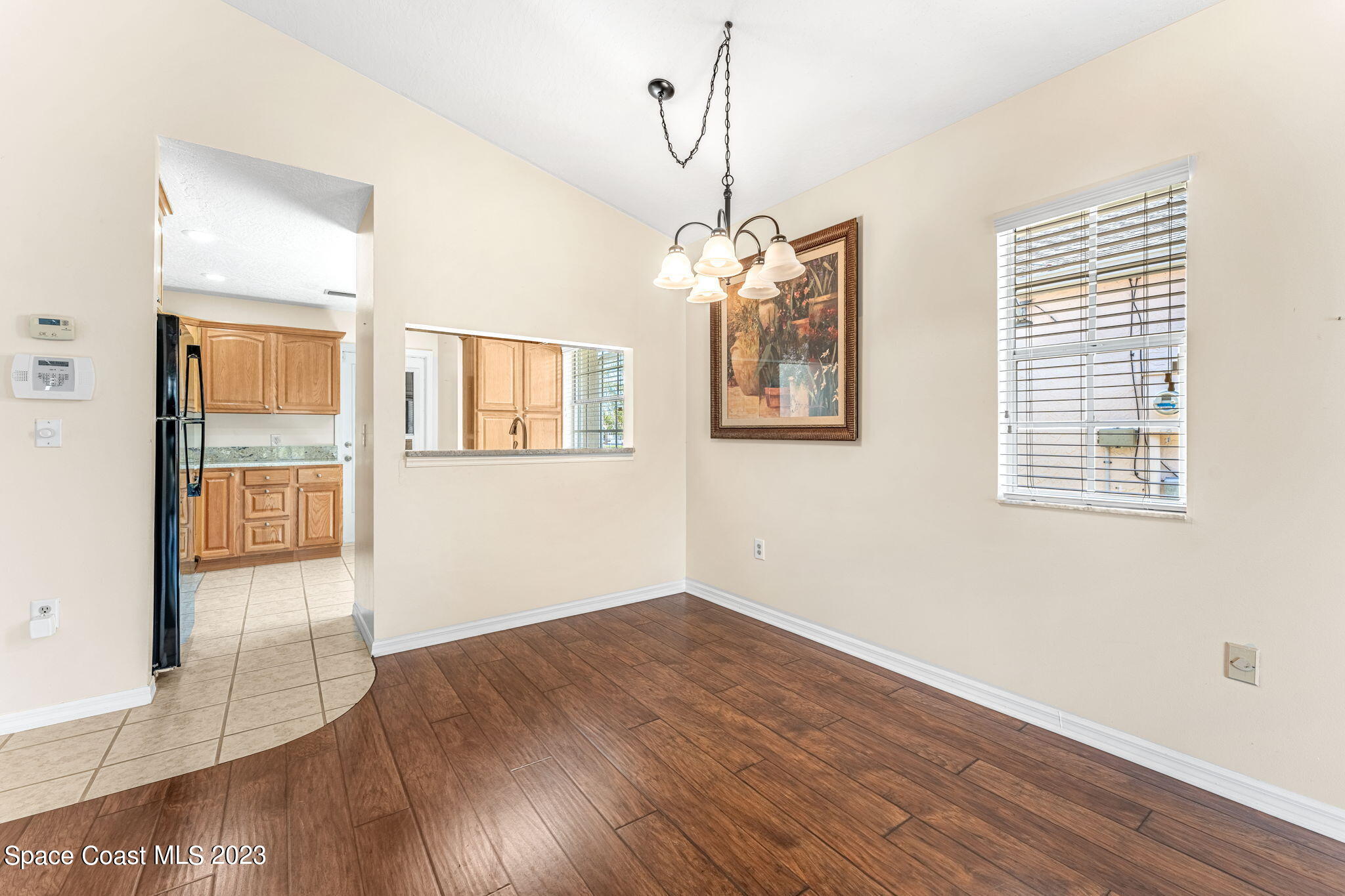 840 Cross Lake Drive Melbourne, FL 32901 - Photo 14 of 63 a view of an empty room with wooden floor and a window