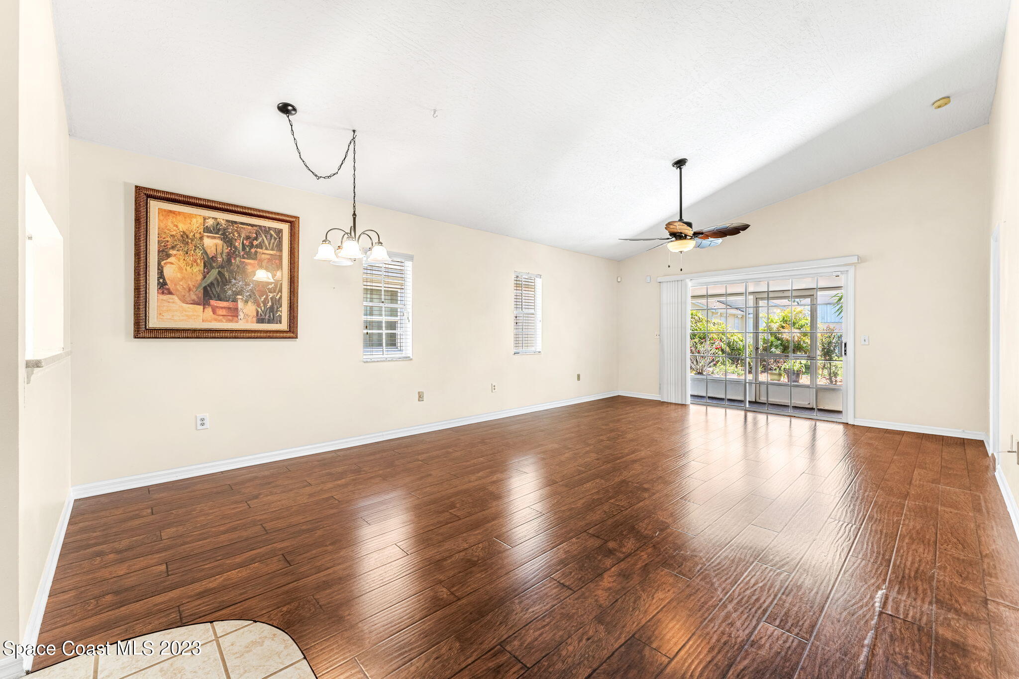 840 Cross Lake Drive Melbourne, FL 32901 - Photo 15 of 63 a view of an empty room with wooden floor and a window