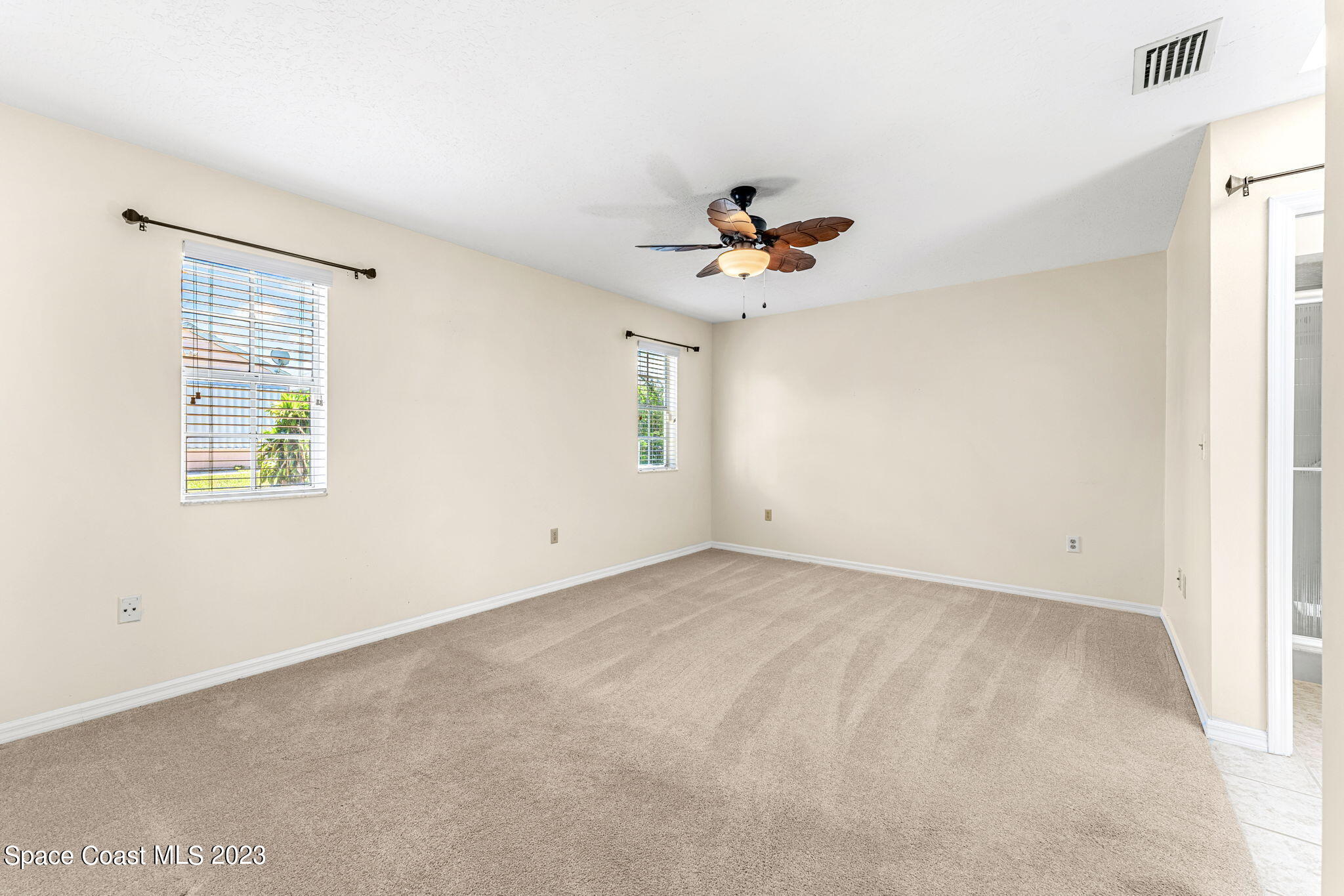 840 Cross Lake Drive Melbourne, FL 32901 - Photo 20 of 63 a view of an empty room with a window