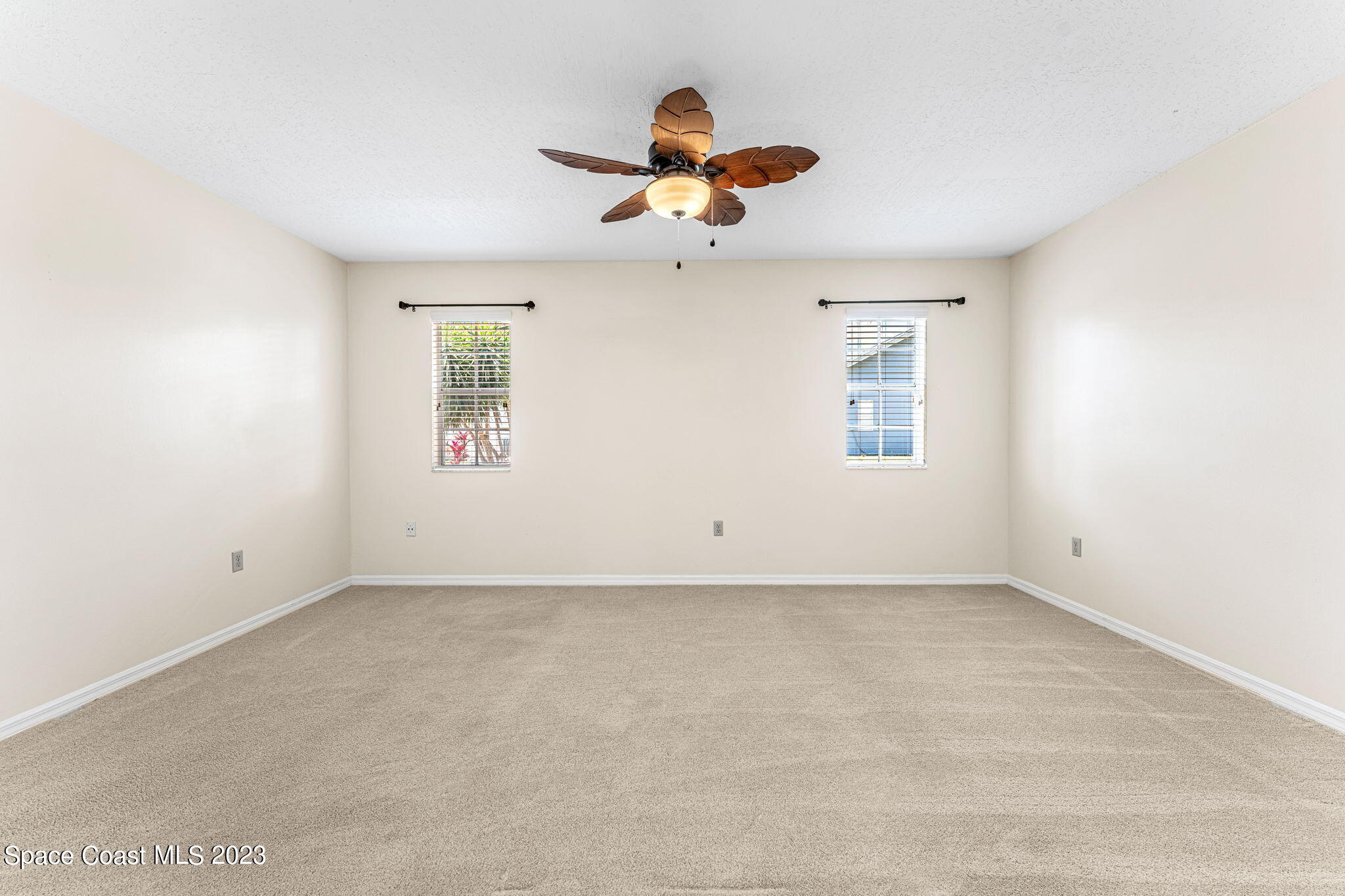 840 Cross Lake Drive Melbourne, FL 32901 - Photo 22 of 63 an empty room with windows