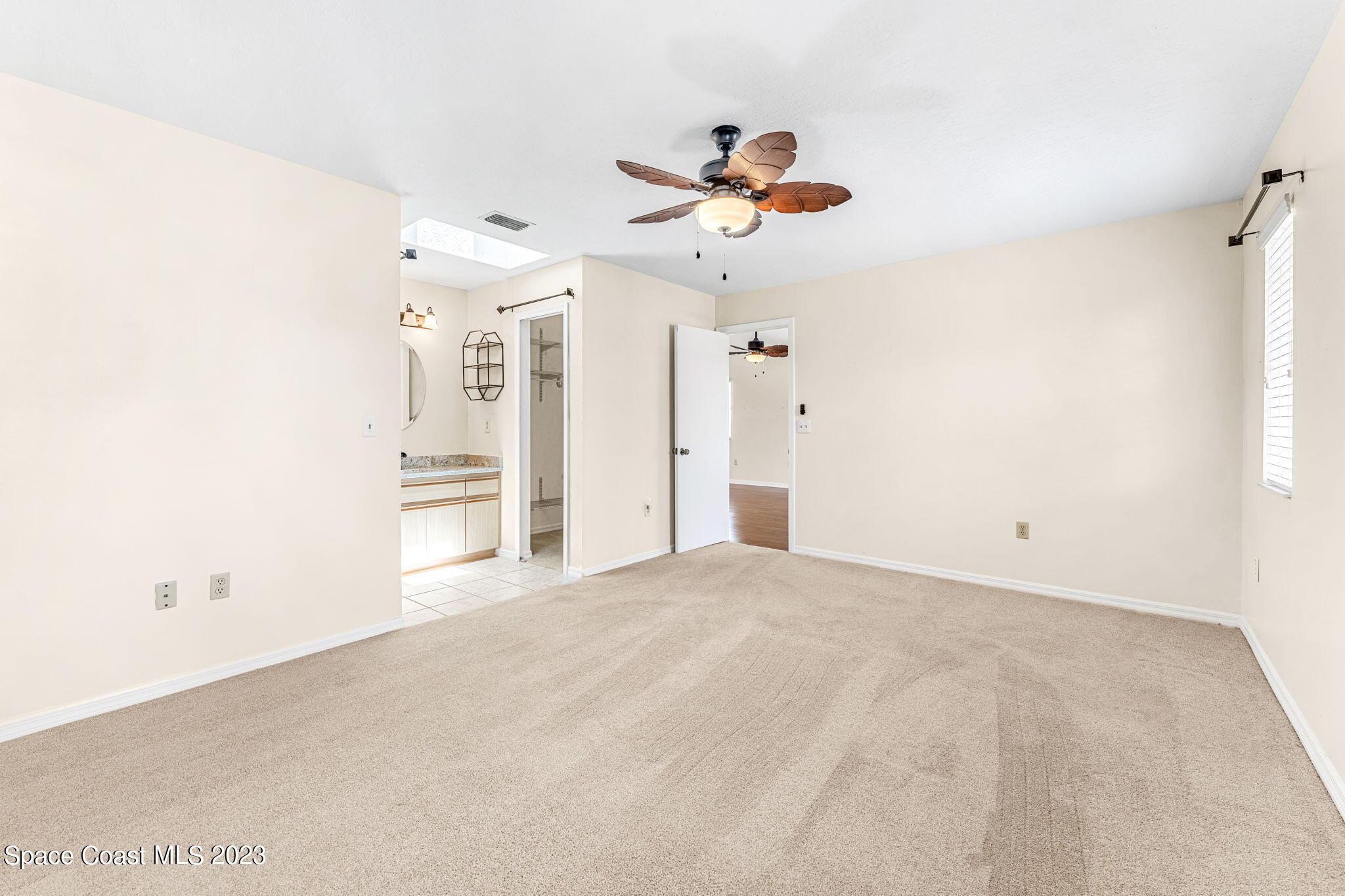 840 Cross Lake Drive Melbourne, FL 32901 - Photo 23 of 63 a view of a livingroom with a chandelier fan
