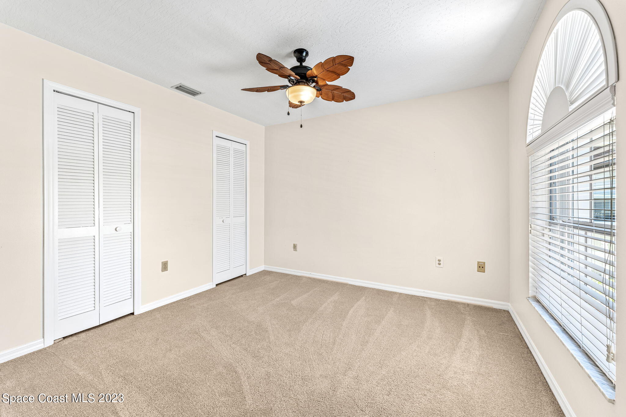 840 Cross Lake Drive Melbourne, FL 32901 - Photo 27 of 63 a view of a room with window and ceiling fan
