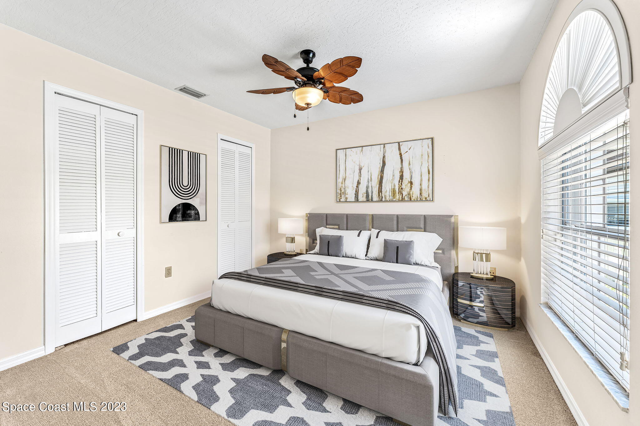 840 Cross Lake Drive Melbourne, FL 32901 - Photo 28 of 63 a bedroom with a bed and a window
