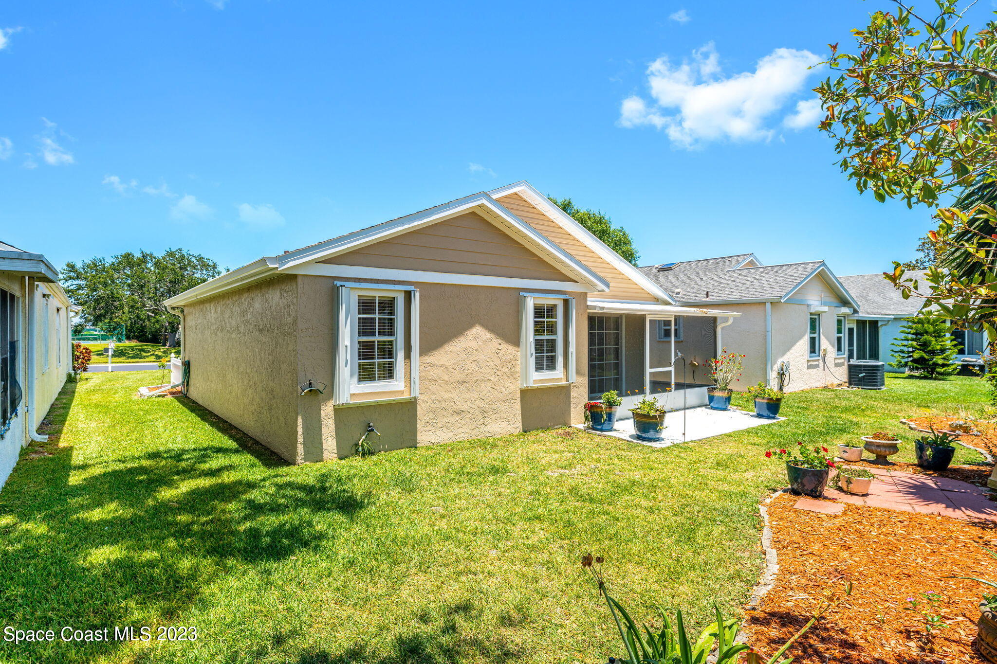 840 Cross Lake Drive Melbourne, FL 32901 - Photo 33 of 63 a front view of a house with garden