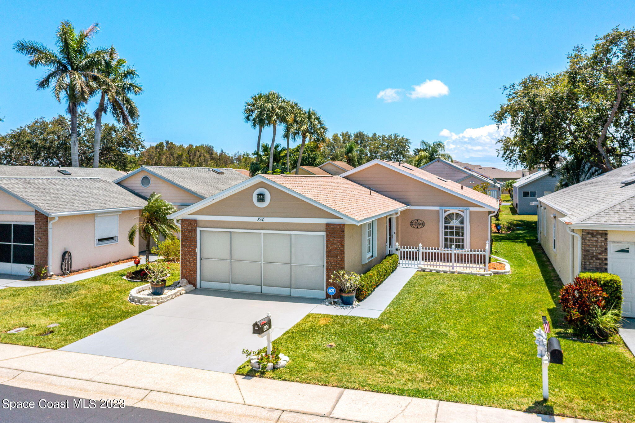840 Cross Lake Drive Melbourne, FL 32901 - Photo 37 of 63 a front view of a house with garden
