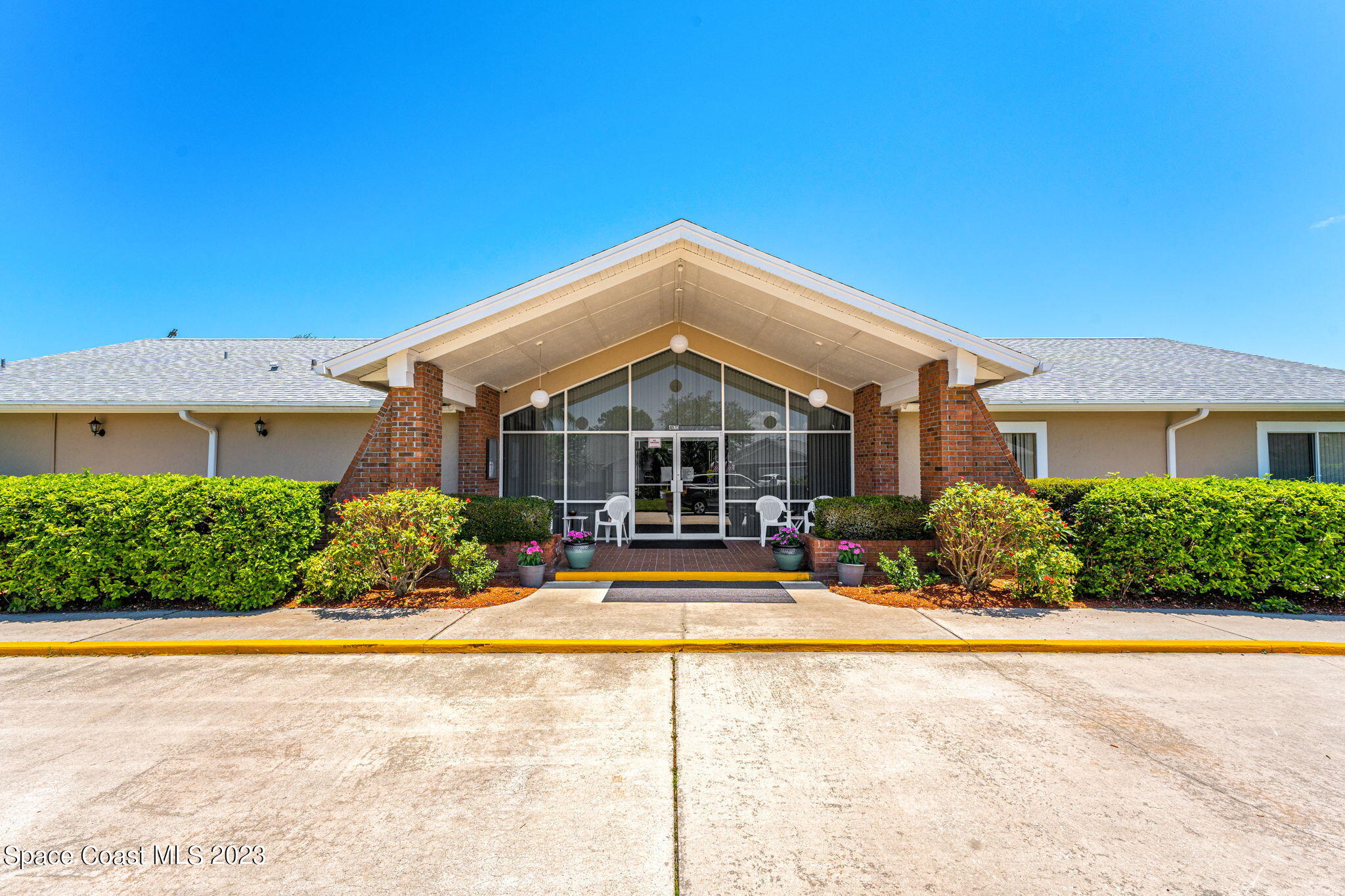 840 Cross Lake Drive Melbourne, FL 32901 - Photo 38 of 63 a front view of a house with a yard