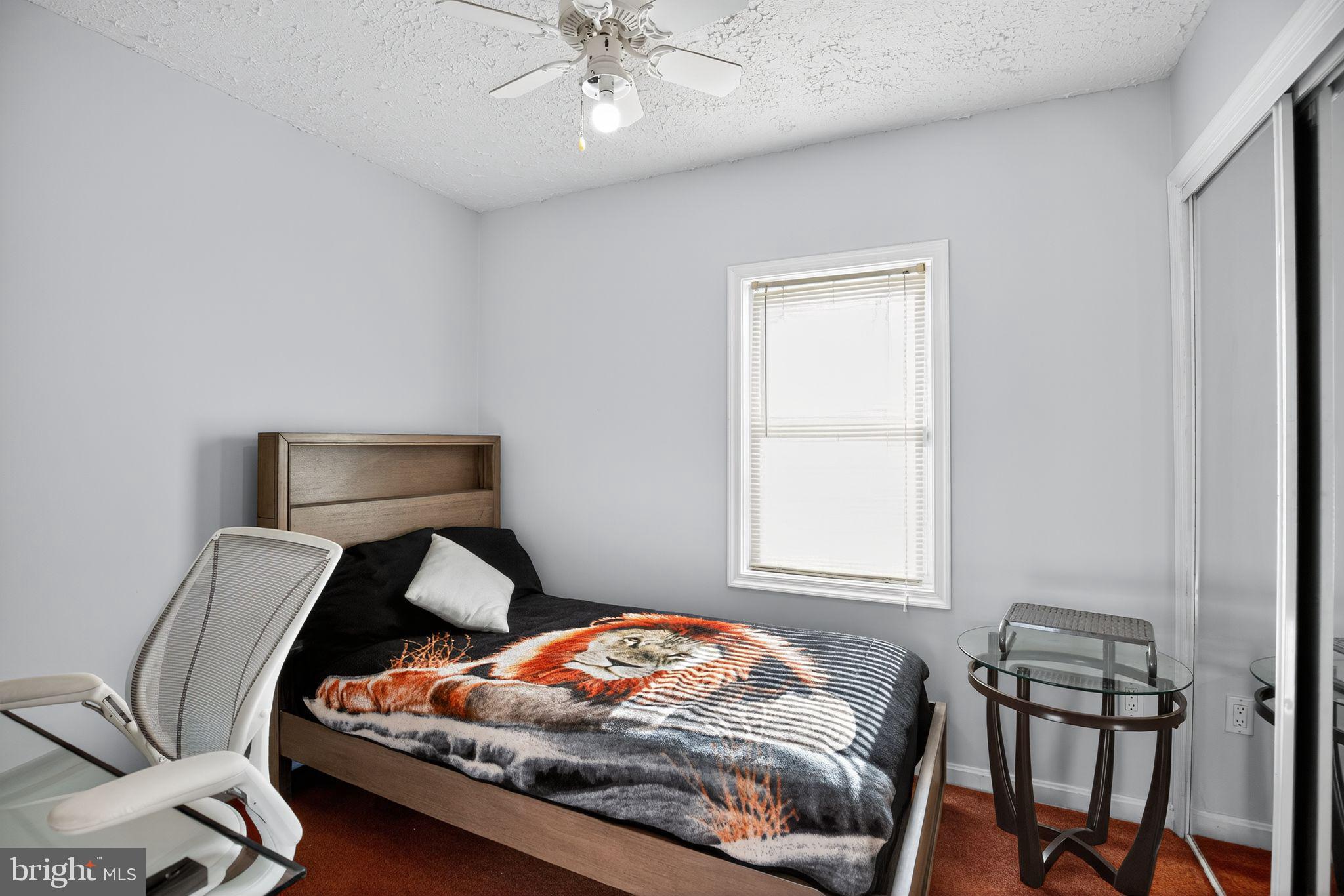 7726 Wills Lane Fort Washington, MD 20744 - Photo 12 of 30 a bedroom with bed and a window