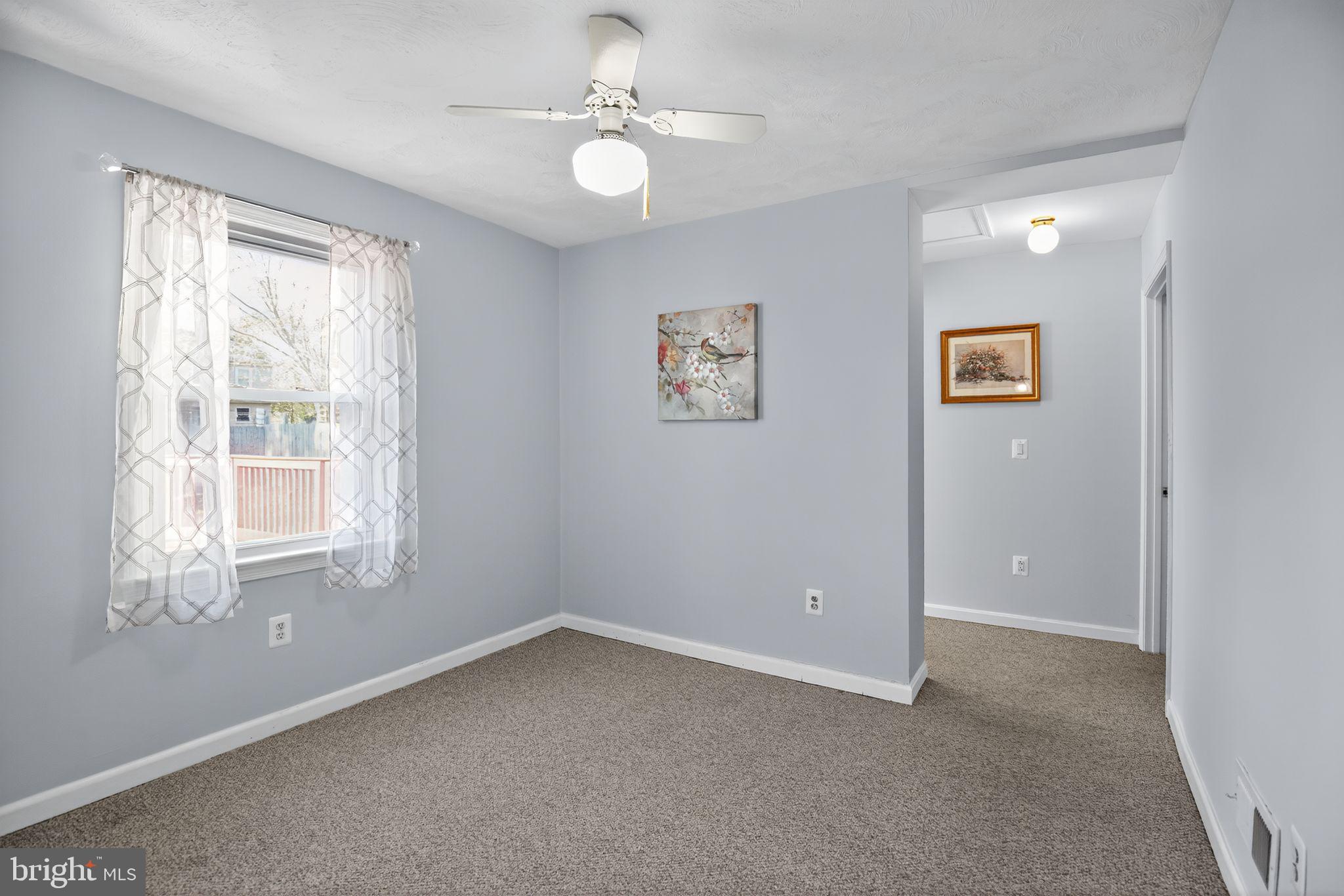 7726 Wills Lane Fort Washington, MD 20744 - Photo 17 of 30 an empty room with windows and fan