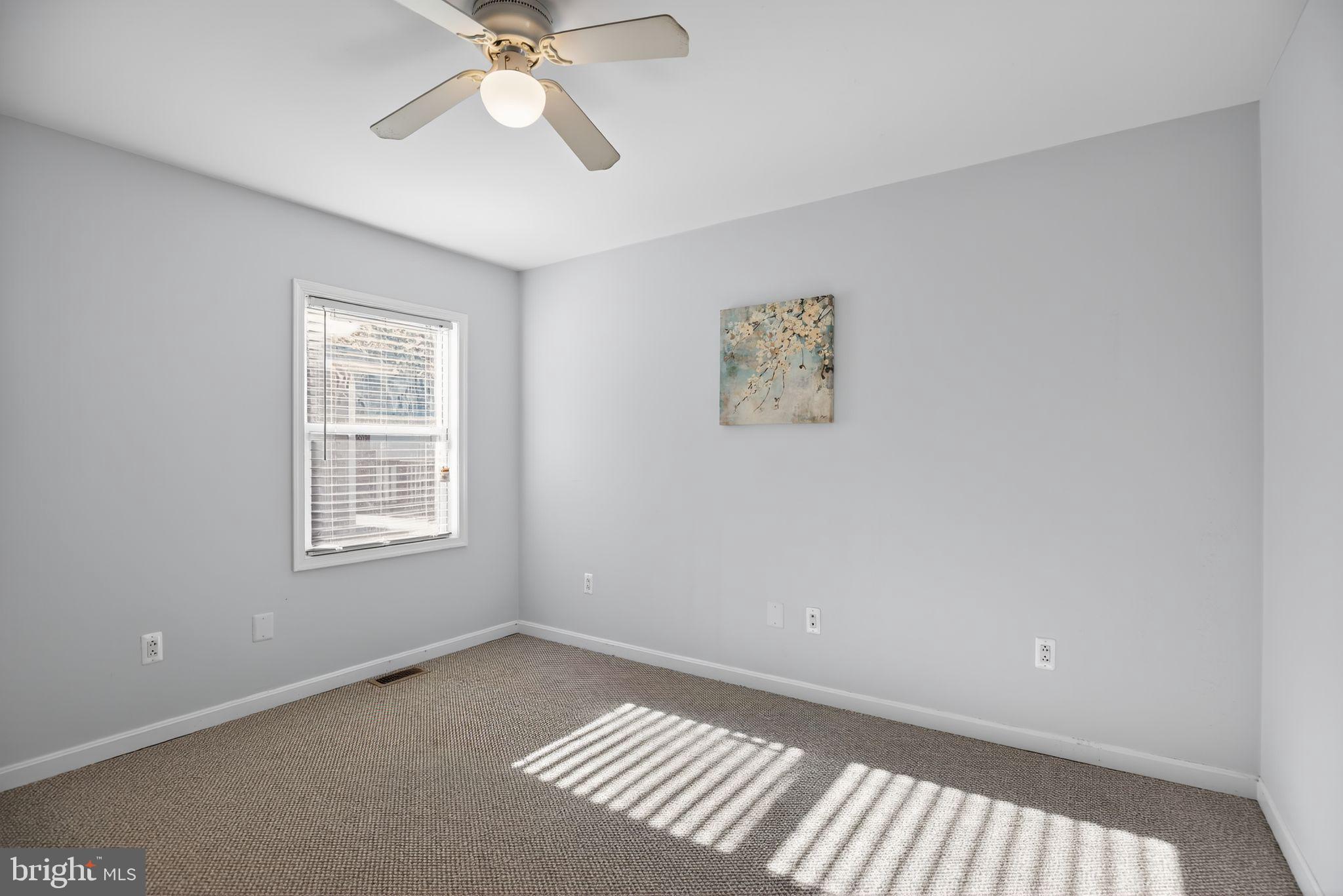 7726 Wills Lane Fort Washington, MD 20744 - Photo 18 of 30 a view of an empty room with a window