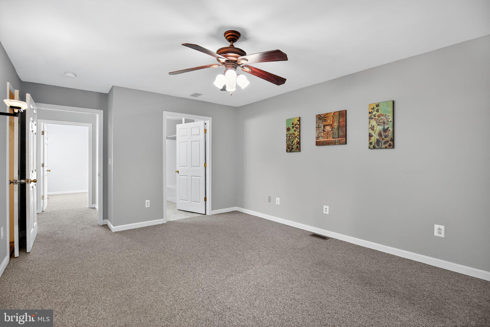 7726 Wills Lane Fort Washington, MD 20744 - Photo 20 of 30 a view of an empty room with a ceiling fan