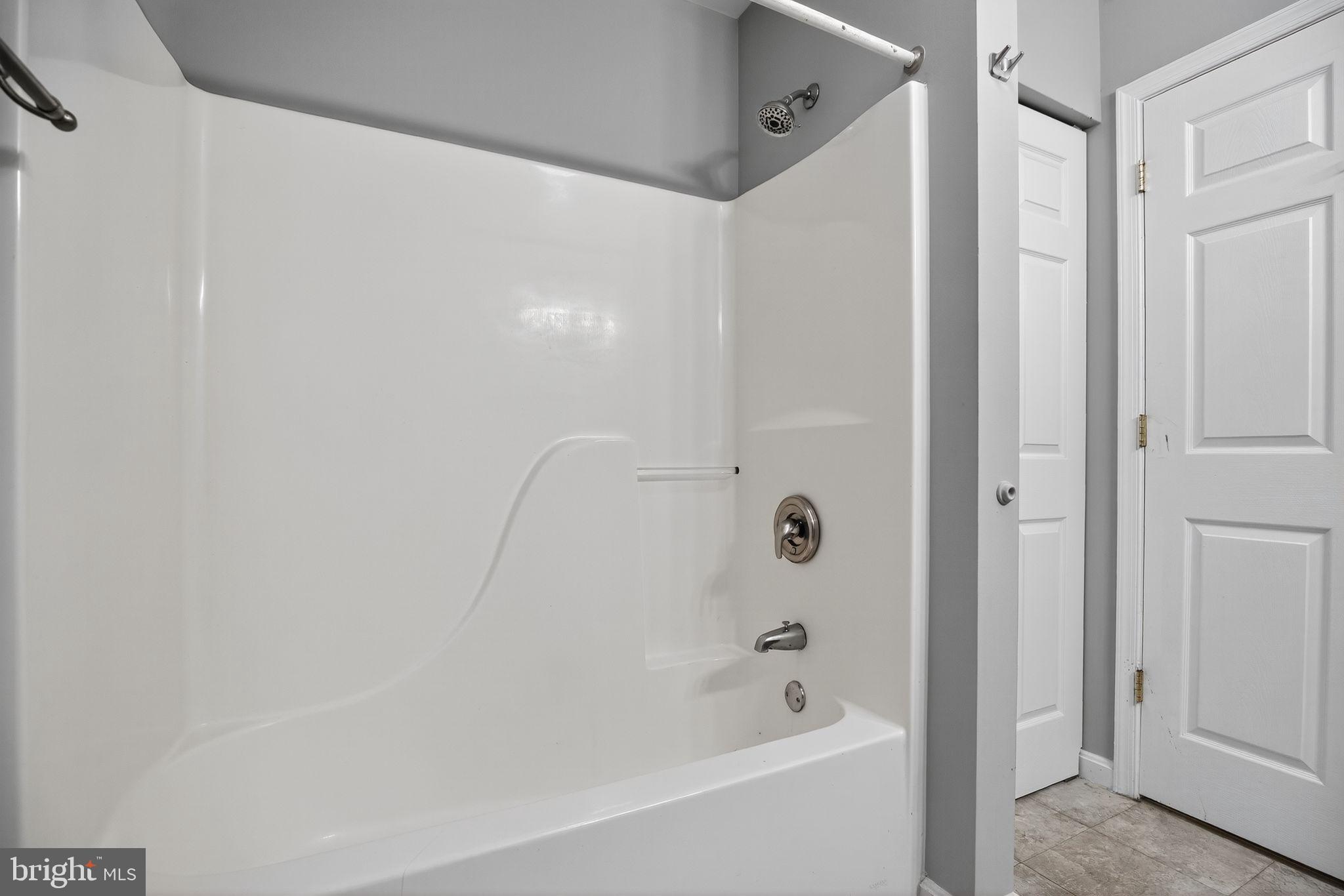 7726 Wills Lane Fort Washington, MD 20744 - Photo 22 of 30 a bathroom with a bathtub